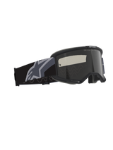 Alpinestars Vision Sand Goggles, Motocross and Off-Road Goggles, Black and Gray with Dark Smoke Lens, wide woven strap featuring a large gray star logo, matte black frame with RAM-AIR ventilation and multi-layer face foam for desert riding protection.