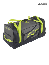 Alpinestars Komodo Travel Bag, durable motorsport gear bag and luggage, black and anthracite with yellow fluo straps and logo branding, waterproof bottom panel for racing and adventure travel