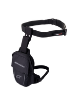 Alpinestars Access Thigh Bag, Black motorcycle leg bag, durable textile construction with adjustable waist belt and thigh strap, featuring Alpinestars branding, reflective piping, and quick-release buckle, ergonomic design for on-bike storage of small essentials.