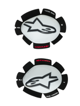 Alpinestars GP Tech Knee Sliders, Motorcycle Knee Protectors, White and Black, set of left and right sliders featuring white plastic shells with black Astar logos, hook-and-loop backing with 'ONE GOAL ONE VISION' text, high-performance racing gear