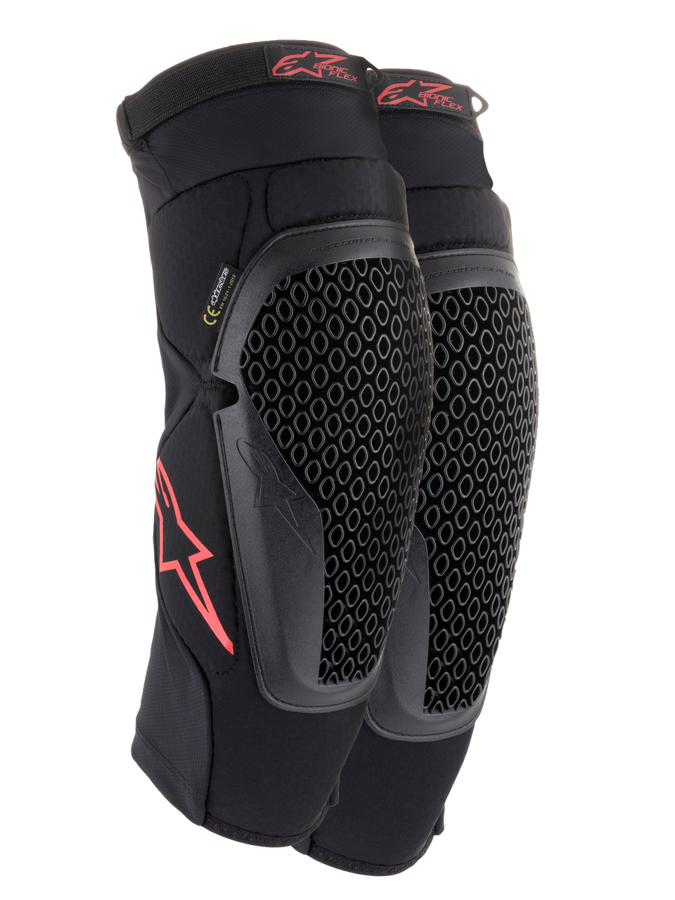 Alpinestars Bionic Flex Knee Protectors, Black and Red, pair of motocross knee guards featuring perforated Nucleon Flex Technology shields, red Astars logos, and elasticated straps on a breathable black mesh sleeve.