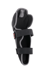 Alpinestars Bionic Action Knee Protector, Motocross Knee Guard, Black and Grey, interior view featuring dual elasticated strap system, foam padding, and ergonomic asymmetrical design for off-road riding