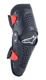 Alpinestars Youth SX-1 Knee Protectors, Motocross Knee Guards, Black and Red, featuring perforated ventilation holes, dual-pivot hinge system, adjustable straps with red buckles, white star logo, youth off-road motorcycle protection