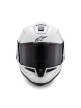 Alpinestars Supertech R10 Solid Helmet, Full-Face Racing Helmet, Glossy White with black details, front view showing dark smoke visor, aerodynamic ventilation system, and black Astars logo