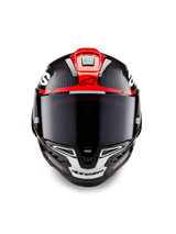 Alpinestars Supertech R10 Element Helmet, Black Carbon with Bright Red and White Glossy graphics, Frontal view featuring a dark smoke visor, visible carbon fiber texture, and integrated ventilation, professional race-grade motorcycle helmet