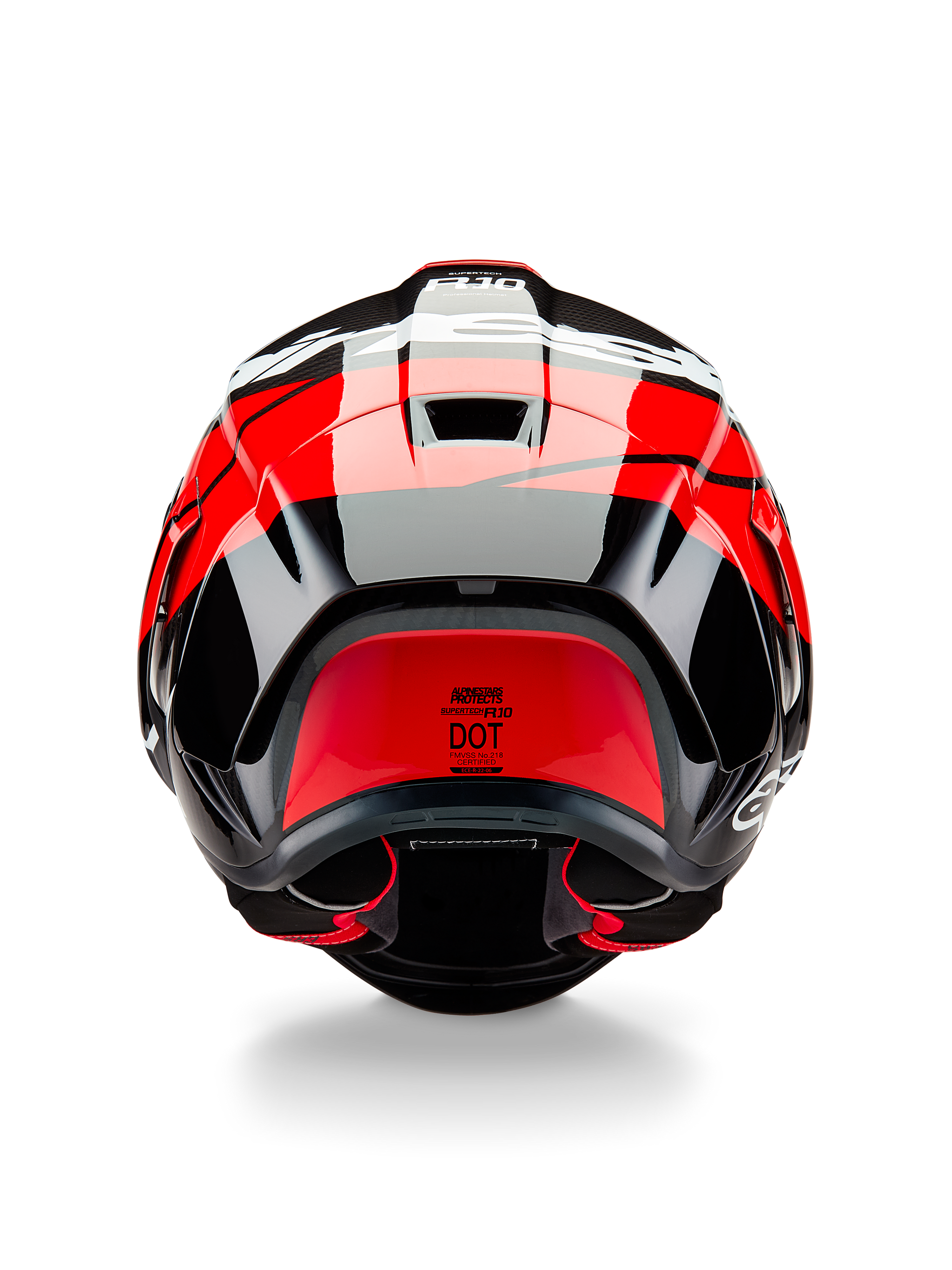 Alpinestars Supertech R10 Element Helmet, rear view, Black Carbon with Bright Red and White Glossy accents, featuring an aerodynamic rear spoiler, exhaust vents, and DOT certification label, sleek racing-inspired design with carbon fiber detailing