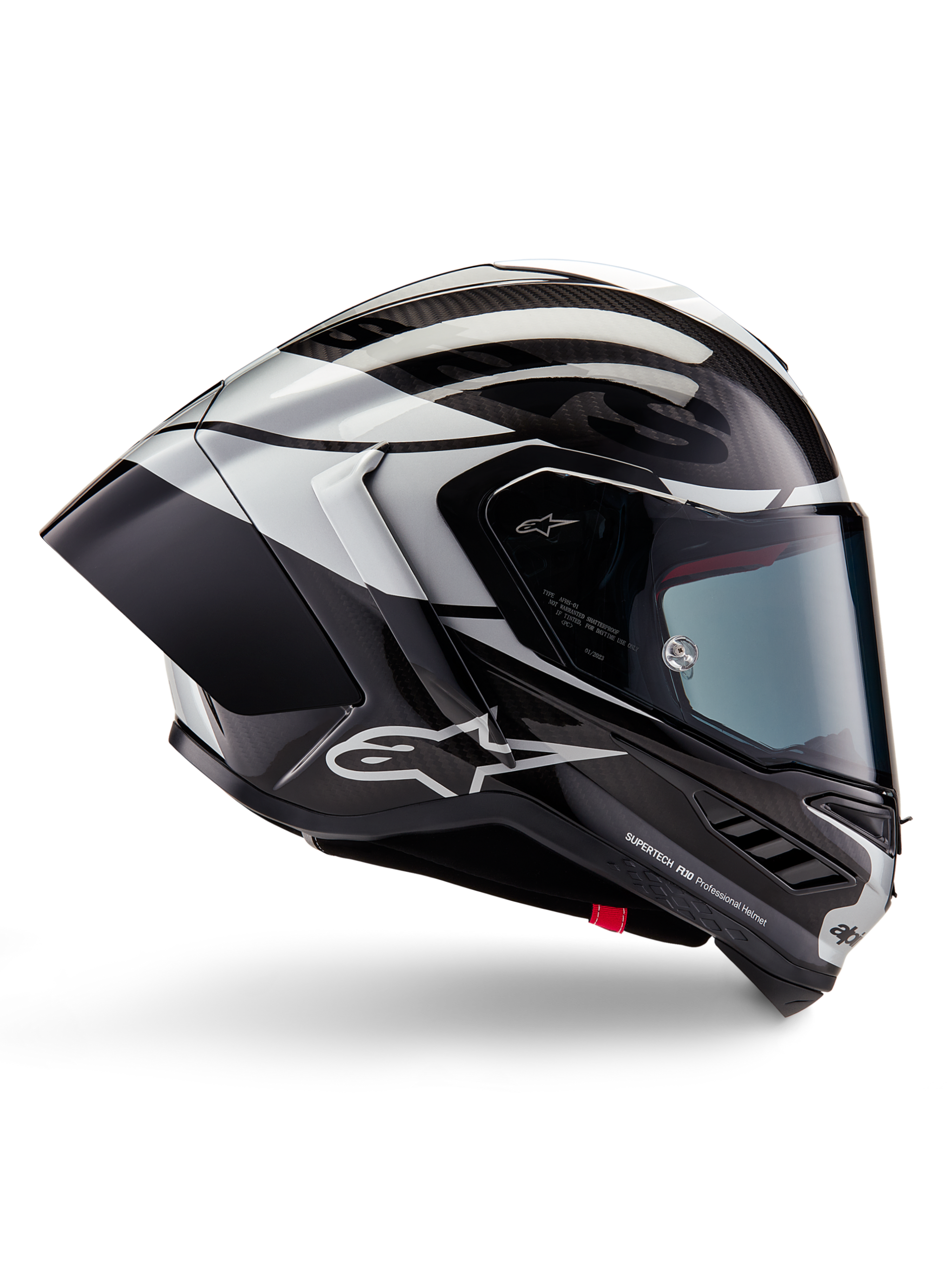 Alpinestars Supertech R10 Element Helmet, Full-Face Motorcycle Racing Helmet, Black Carbon, Silver, and Black Glossy finish, side profile view featuring aerodynamic carbon fiber shell, clear visor, and bold Alpinestars branding