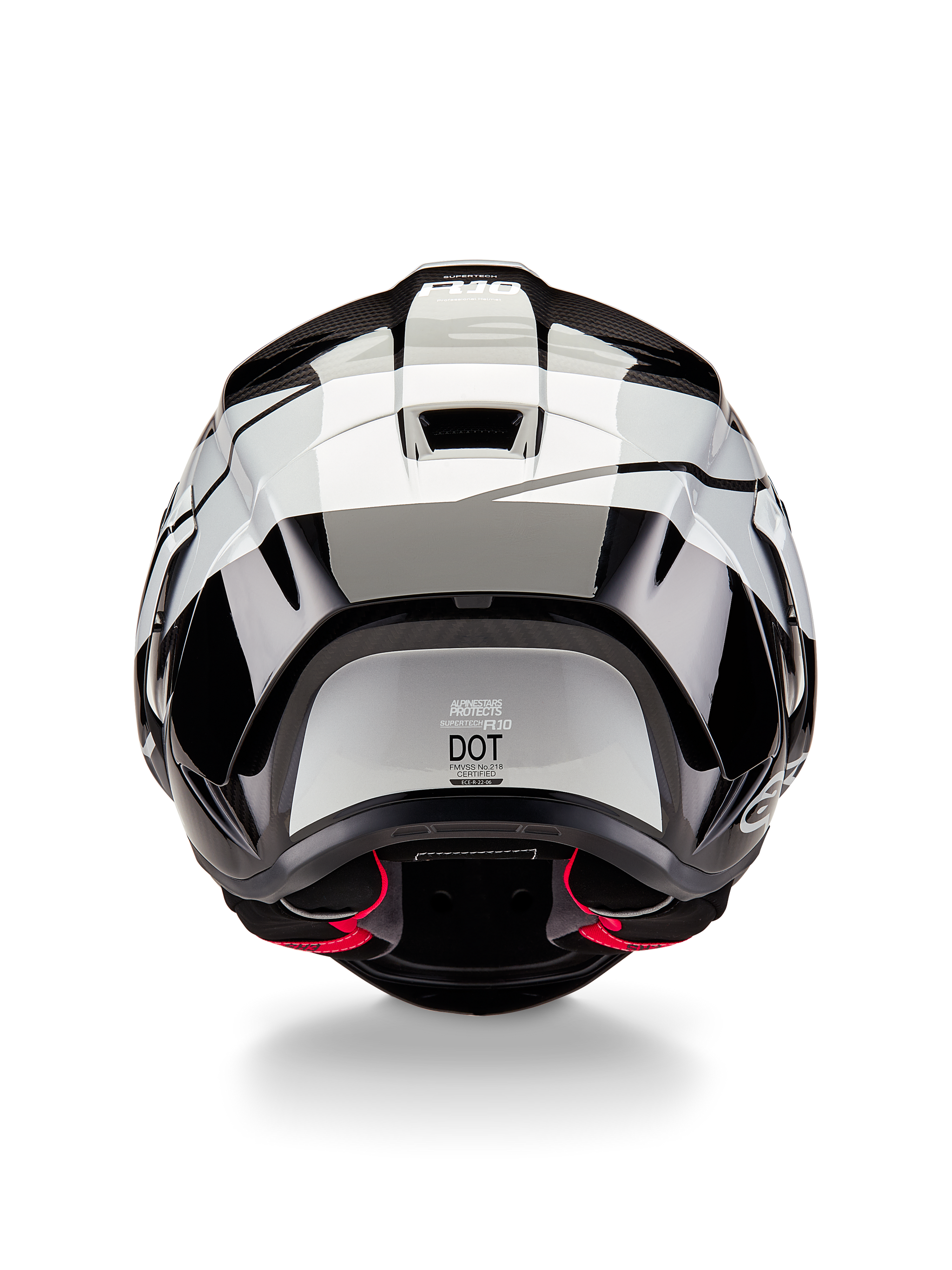 Alpinestars Supertech R10 Element Helmet, Rear View, Black Carbon Silver Black Glossy, featuring aerodynamic spoiler design, DOT certification label, and red interior padding accents, professional racing head protection