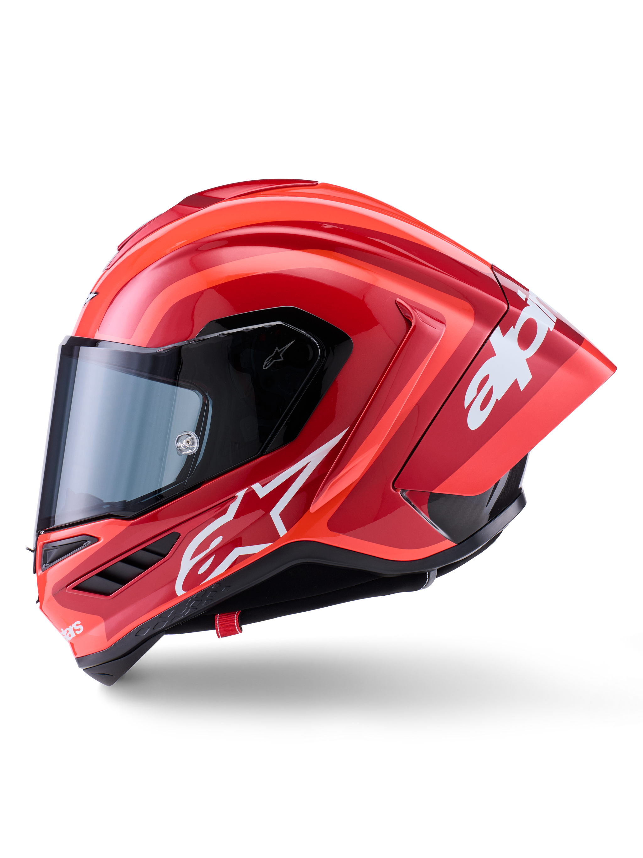 Alpinestars Supertech R10 Arius Helmet, Full-Face Racing Helmet, Glossy Red with white logo graphics, side profile view highlighting aerodynamic spoiler and clear visor, carbon fiber composite shell for professional motorsport