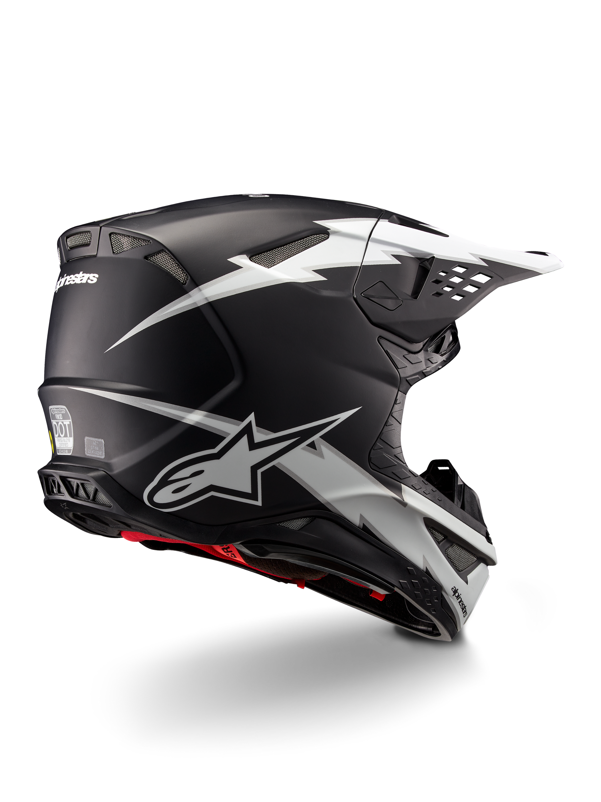Alpinestars Supertech M10 Ampress Helmet, Motocross Helmet, Black and White Matte, featuring bold white lightning bolt graphics on a matte black shell, rear three-quarter view showing Alpinestars branding and ventilation ports