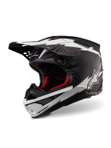 Alpinestars Supertech M10 Ampress Helmet, Motocross Helmet, Matte Black and White, featuring bold white lightning-style graphics and star logos, red internal lining, multi-composite carbon shell with a streamlined aerodynamic profile