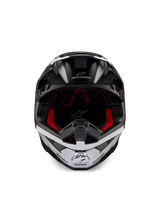 Alpinestars Supertech M10 Ampress Helmet, Motocross Helmet, Black and White Matte, front view with red interior lining, aerodynamic shell featuring ventilation ports and Alpinestars logo
