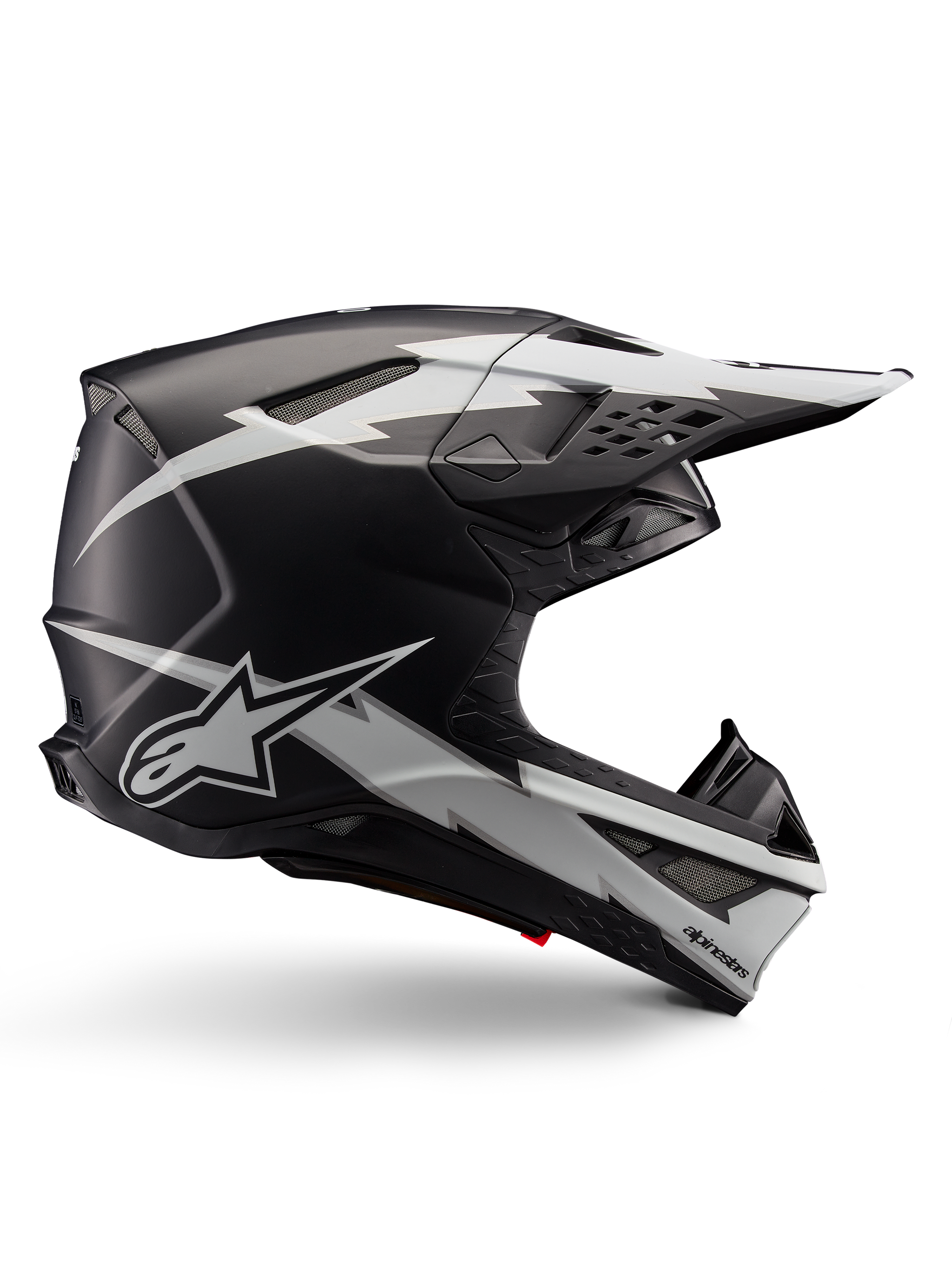 Alpinestars Supertech M10 Ampress Helmet, Motocross Racing Helmet, Black and White Matte, aerodynamic profile with white lightning bolt graphics, multiple air vents, extended sun visor, carbon fiber construction with matte finish