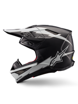 Alpinestars Supertech M10 Ampress Helmet, Motocross Helmet, Matte Black and White, profile view featuring bold white lightning-style graphics, aerodynamic shell with visible ventilation ports and visor, advanced off-road protection