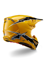 Alpinestars Supertech M10 Ampress Helmet, Motocross Helmet, Black Yellow Glossy, featuring a high-gloss yellow finish with black and white lightning-style graphics, rear three-quarter view showing aerodynamic shell and integrated ventilation ports.