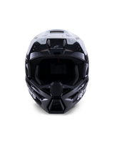 Alpinestars S-M3 Radium Helmet, Motocross Helmet, Black White and Gray Glossy, front-facing view, featuring an aggressive shell design with a white visor, black chin guard, and mesh-lined ventilation ports.