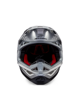 Alpinestars Supertech M10 Flood ECE 22.06 Helmet, Motocross Helmet, Silver Black and Orange Fluo, front view featuring an aerodynamic shell, wide eye port with red interior padding, black Alpinestars logo, and ventilated chin bar for off-road racing