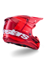 Alpinestars S-M7 Core Helmet, Motocross Helmet, Red Glossy with large white Alpinestars logo on the side, featuring an aerodynamic shell, integrated ventilation ports, and protective visor, 3/4 rear view