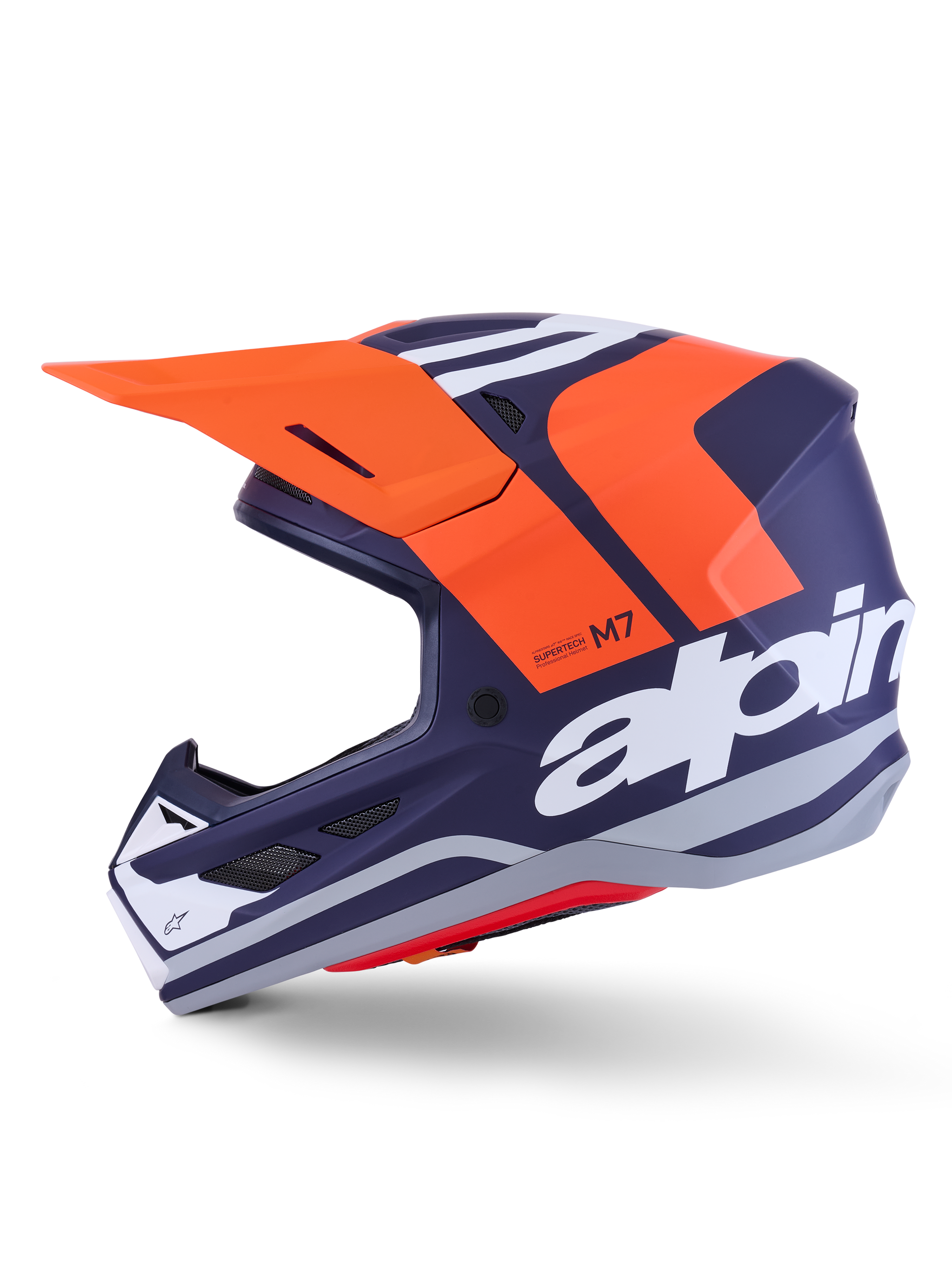 Alpinestars S-M7 Core Helmet ECE 22.06, side profile, navy blue and orange matte finish, large white branding on side, aerodynamic motocross helmet with protective visor