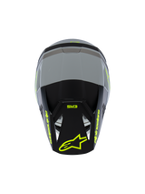 Alpinestars S-M3 Youth Radium Helmet ECE 22.06, Motocross Helmet, Matte Gray and Black with Fluorescent Yellow accents, Top view showing Alpinestars and SM3 branding, specialized youth off-road head protection