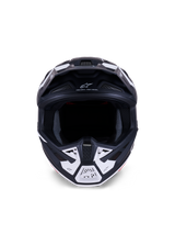 Alpinestars S-M7 Dasher Helmet ECE 22.06, Motocross Helmet, Matte Black and White, Front view showing ventilation ports and geometric graphics, features "ONE GOAL - ONE VISION" text, professional off-road racing protection