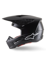 Alpinestars S-M5 Solid Helmet ECE 22.06, Motocross Helmet, Black Matt, side profile view featuring a sleek matte finish, white Alpinestars logo on the side, red interior padding, and aerodynamic shell with integrated ventilation ports