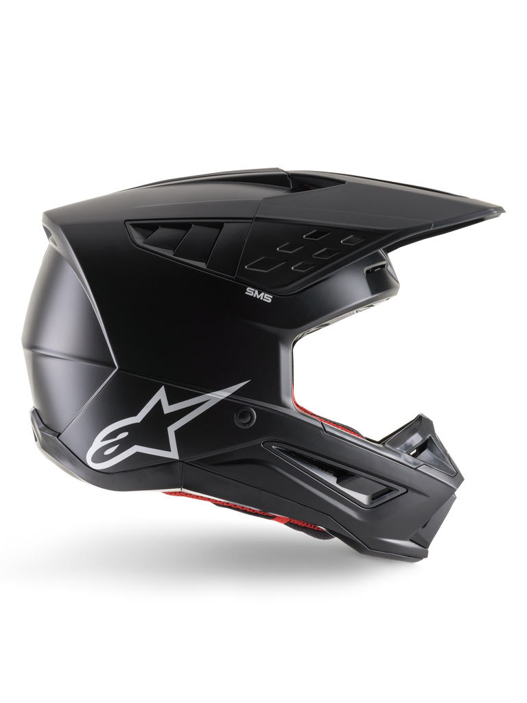 Alpinestars S-M5 Solid Helmet, Motocross Helmet, Matte Black, featuring white Alpinestars star logo and red interior lining, aerodynamic design with multiple air vents and long visor, ECE 22.06 certified off-road protection
