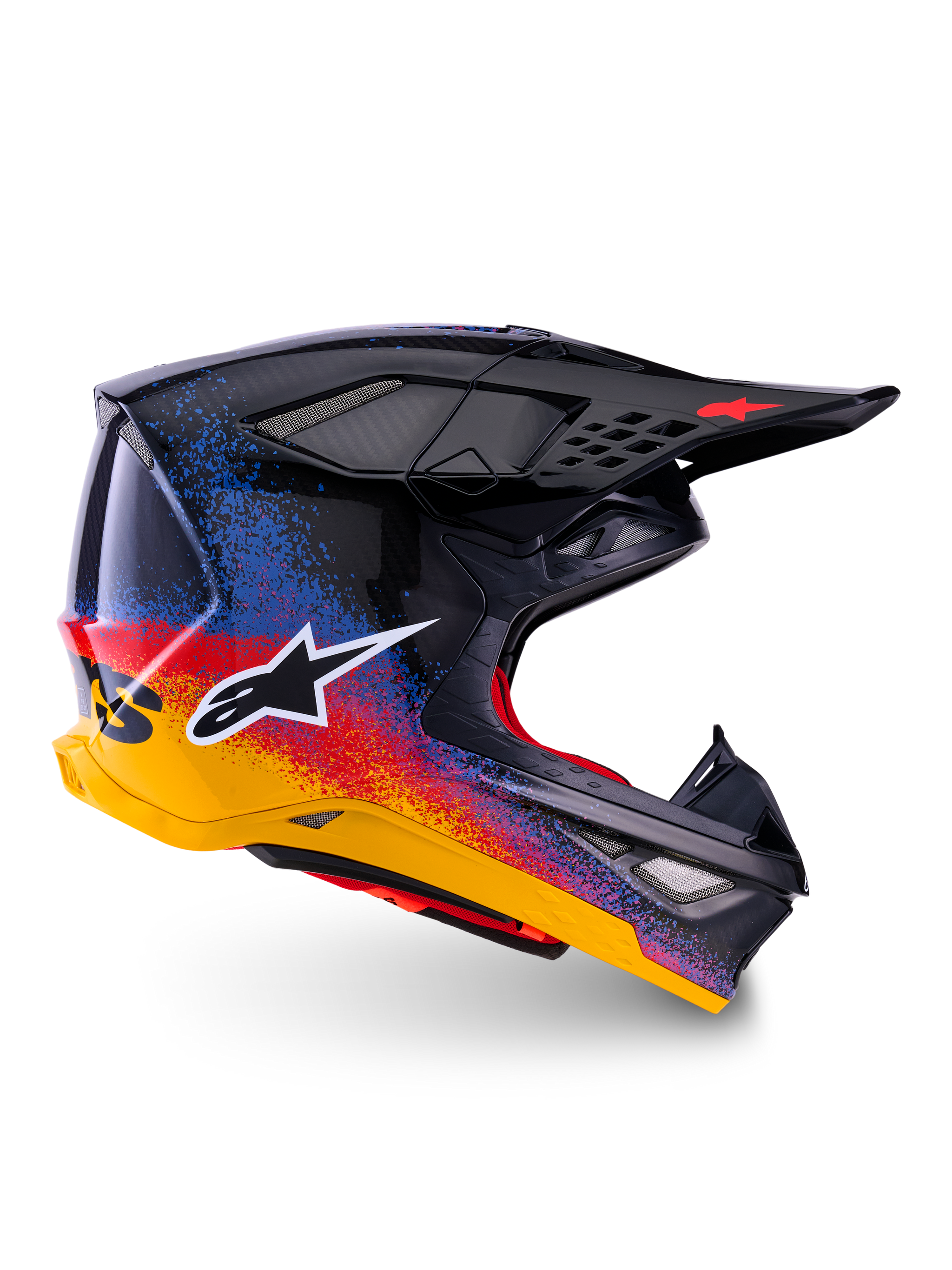 Alpinestars Limited Edition Supertech M10 Black Hole Helmet, Motocross Racing Helmet, Black shell with red, blue, and yellow gradient splatter design, white star logo on side, aerodynamic profile with mesh-covered ventilation ports, red interior padding, and long black visor.