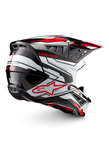 Alpinestars S-M5 Action 2 Helmet, motocross helmet in glossy black, white and bright red, side view with peak visor, ventilation openings and graphic detailing.