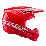 Alpinestars S-M5 Corp Helmet ECE, Motocross Helmet, Bright Red Glossy, side profile view showing a large white Alpinestars logo on the lower shell, aerodynamic ventilated visor with star logo, and high-gloss finish for off-road racing protection