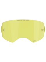 Alpinestars Supertech Clear Lens, Motocross Goggle Replacement Lens, Yellow tint, featuring "ONE GOAL. ONE VISION." branding, integrated tear-off posts, transparent impact-resistant polycarbonate construction.