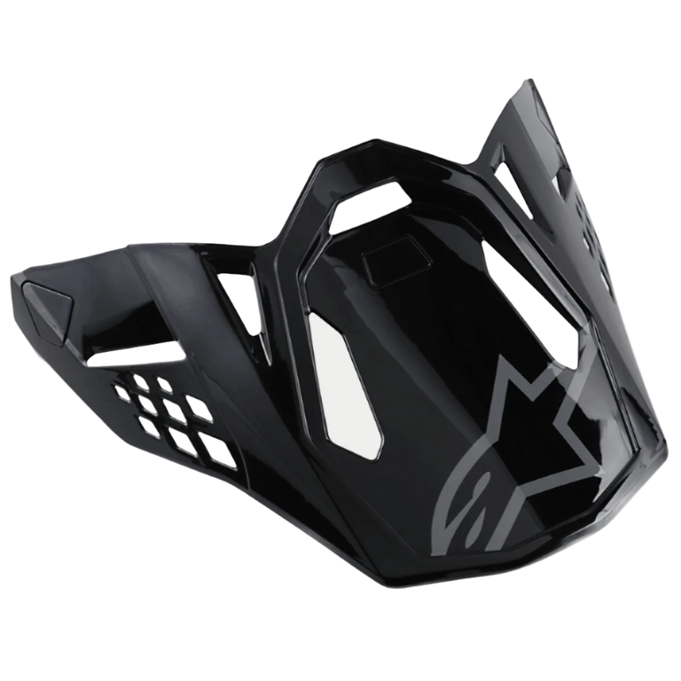 Alpinestars S-M8 Helmet Visor Radium, Glossy Black motorcycle helmet peak with gray Alpinestars logo, featuring aerodynamic angular cutouts and sharp edges, modern racing style for off-road helmets