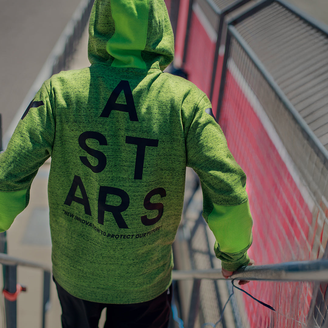 Alpinestars Perpetuate Hoodie, back view, Lime Green heathered fleece, large black ASTARS text graphic on the back, casual sportswear with fabric blocking and drawstring hood