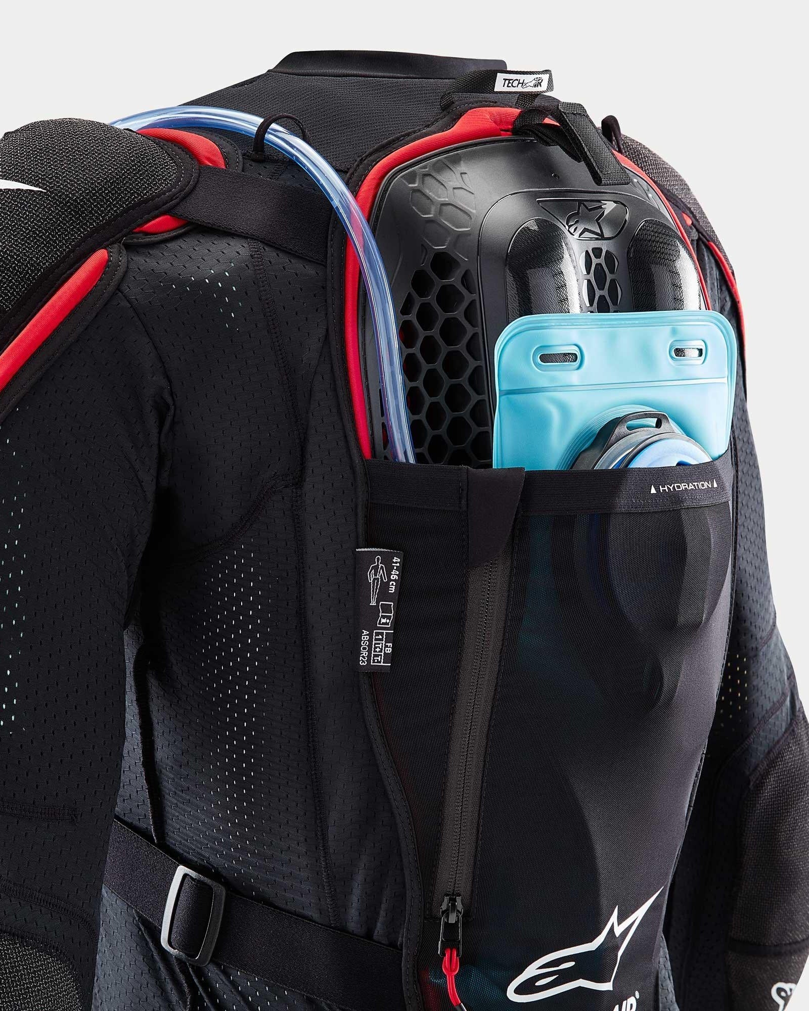 Alpinestars Tech-Air® Off-Road System, black and red mesh jacket with blue hydration bladder and honeycomb back protector.