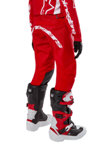 Alpinestars Youth 2024 Racer Lurv Pants in Mars Red and White, technical motocross pants worn for off-road performance.