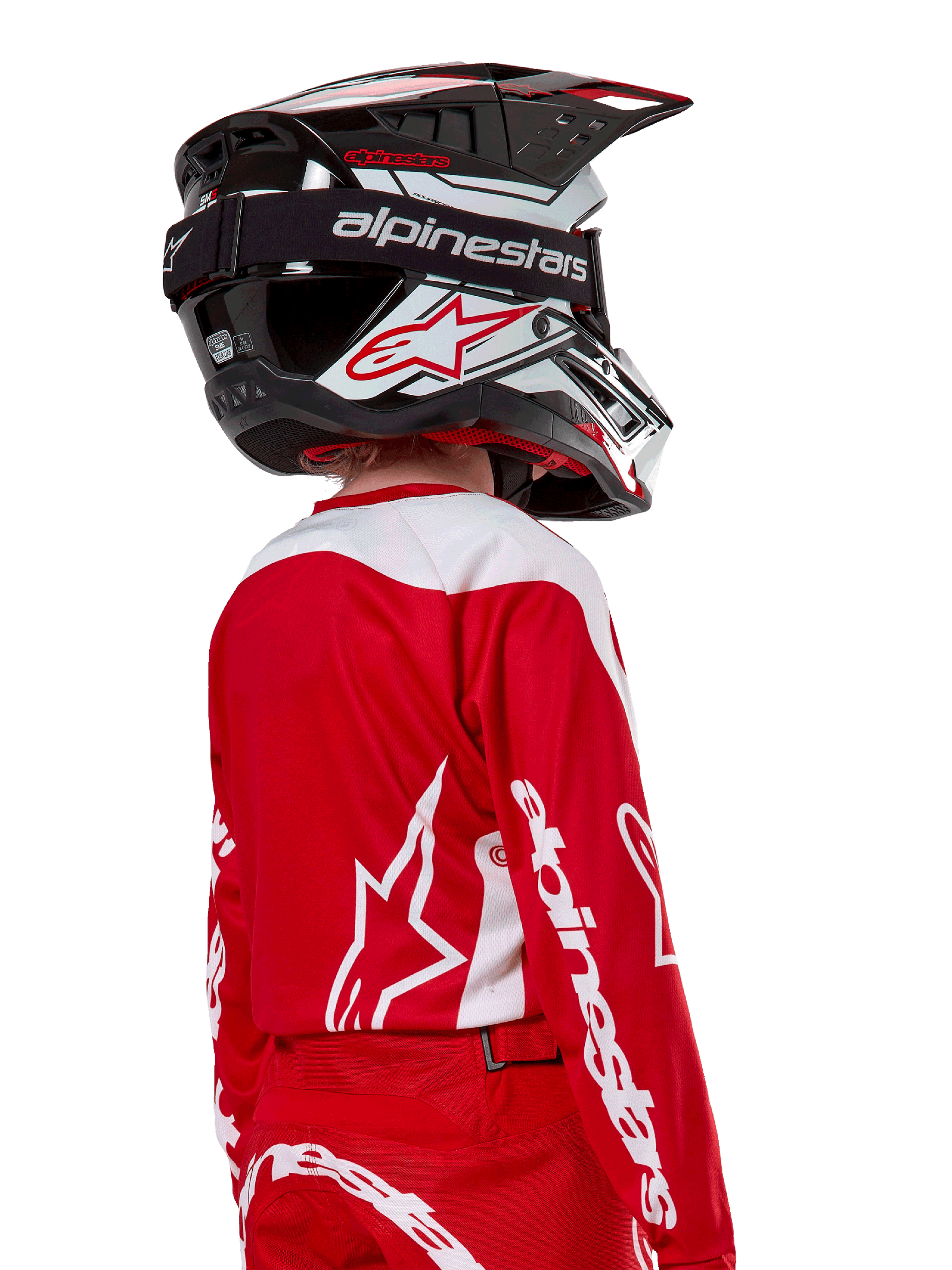 Alpinestars Youth 2024 Racer Lurv Jersey, Mars Red and White motocross jersey, rear view of a rider in racing gear.