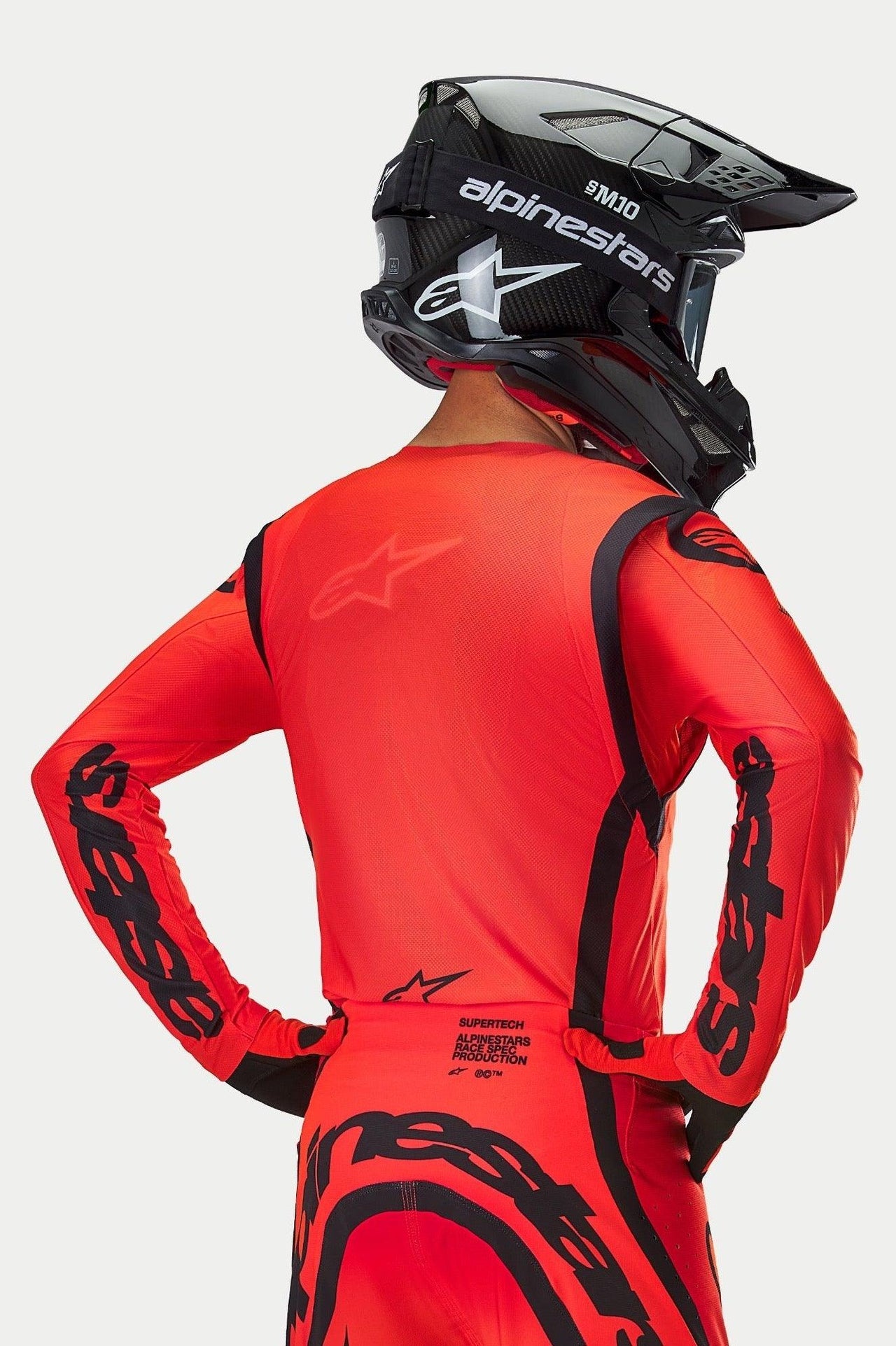 Alpinestars Supertech Ember LE Jersey, Red Fluo and Black motocross racing gear featuring lightweight mesh and athletic fit.