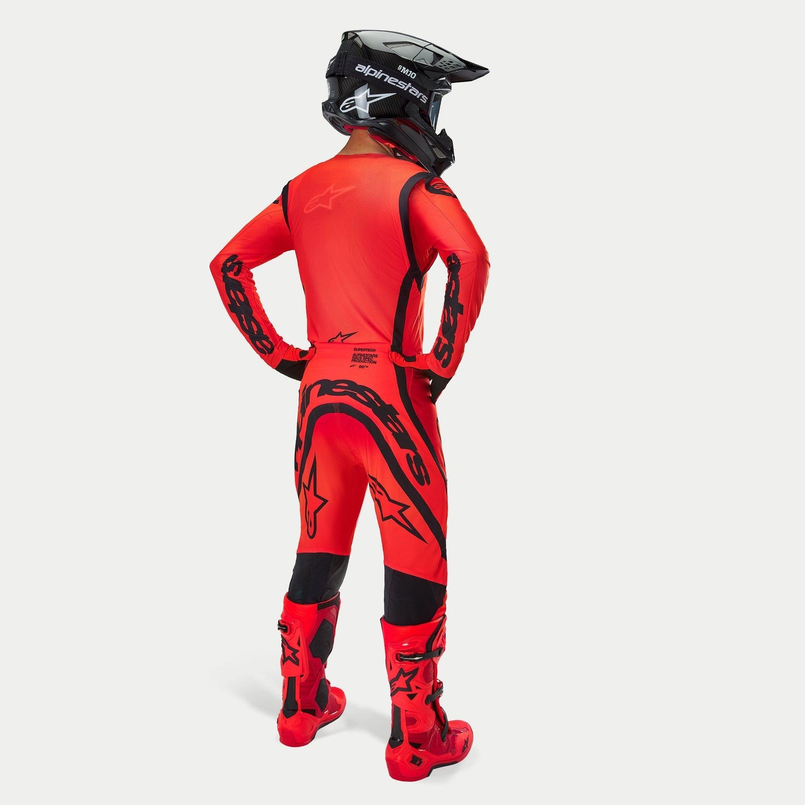 Alpinestars Supertech Ember LE Jersey, Men's Motocross Racing Gear, Red Fluo and Black, athletic race fit, back view.