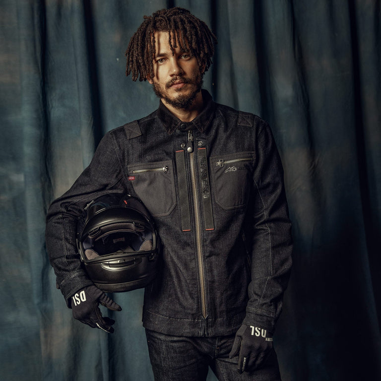 Alpinestars X Diesel AS-DSL Toshio Denim Overshirt, Rinse Blue/Black urban motorcycle jacket, man holding a black helmet.